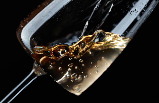 istock White wine being poured into wine glass. 1065738166
