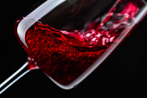 istock Red wine being poured into wineglass. 1065738190
