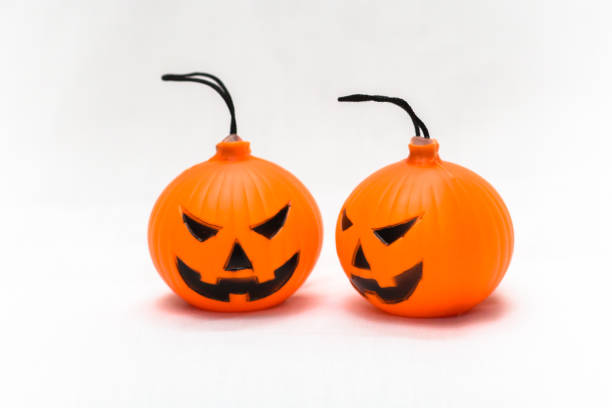 istock Rubber toy pumpkin for halloween decoration isolated on white background 1065743258