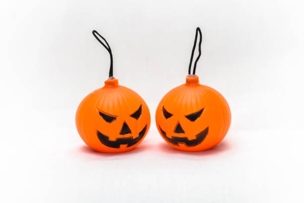 istock Rubber toy pumpkin for halloween decoration isolated on white background 1065743270