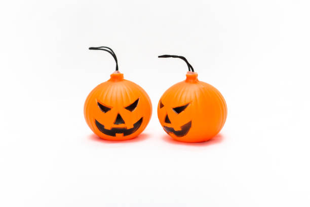 istock Rubber toy pumpkin for halloween decoration isolated on white background 1065743276