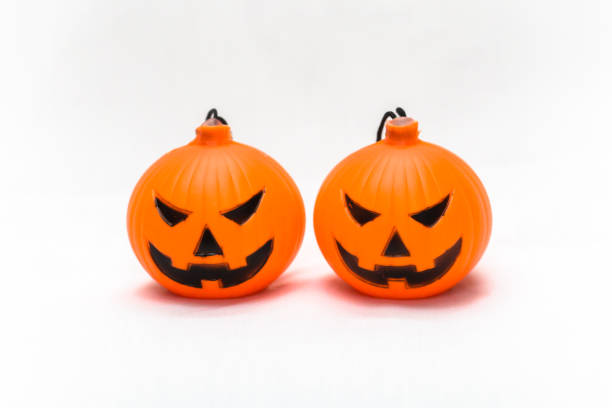 istock Rubber toy pumpkin for halloween decoration isolated on white background 1065743278