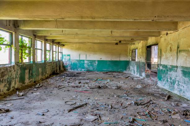 istock Step inside of abandoned old factory in eastern Europe. 1065744210