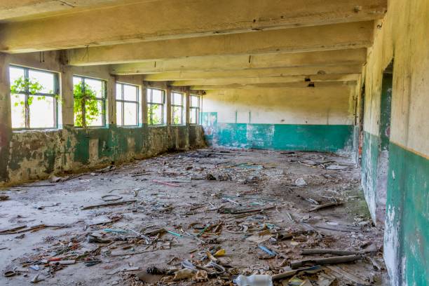 istock Step inside of abandoned old factory in eastern Europe. 1065744582