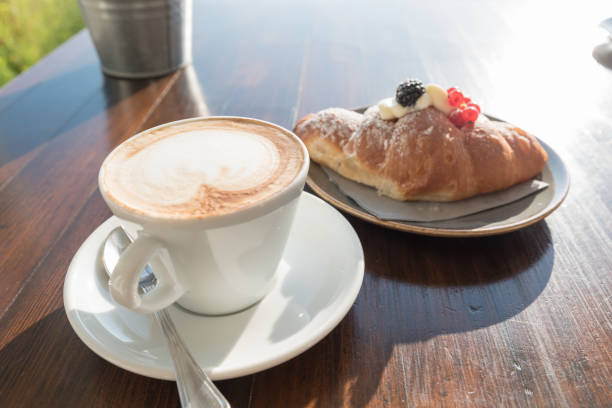istock Breakfast at the beach with pasta and capuccino 1065755938