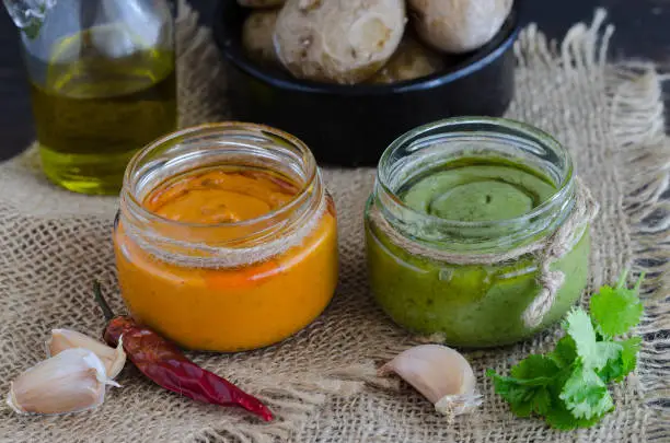 Photo of Two most popular Canary Islands popular sauses Mojo picon (Red hot sause) and  Mojo verde (Green sause) are usually eaten with Papas Arrugadas (wrinkly potatoes).