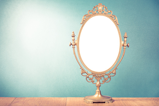 Old vintage makeup mirror frame for background. Retro style filtered photo
