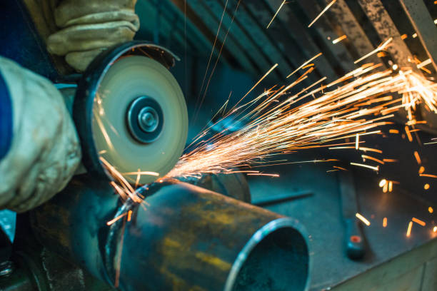 istock mechanic cleans a welded seam 1065759926