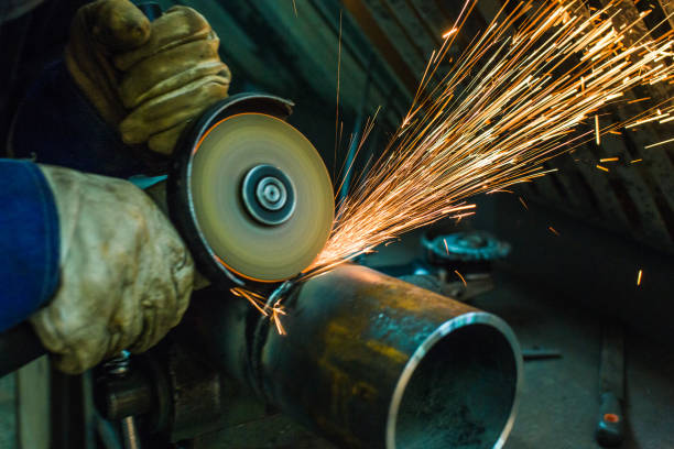 istock mechanic cleans a welded seam 1065759928