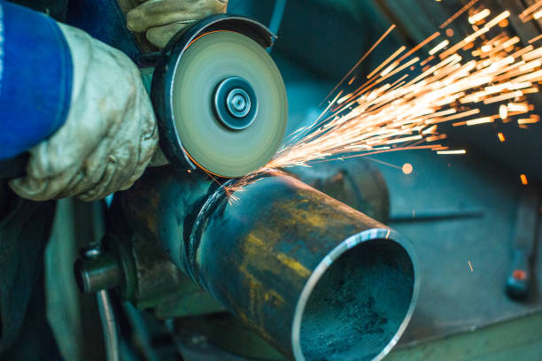 istock mechanic cleans a welded seam 1065760230