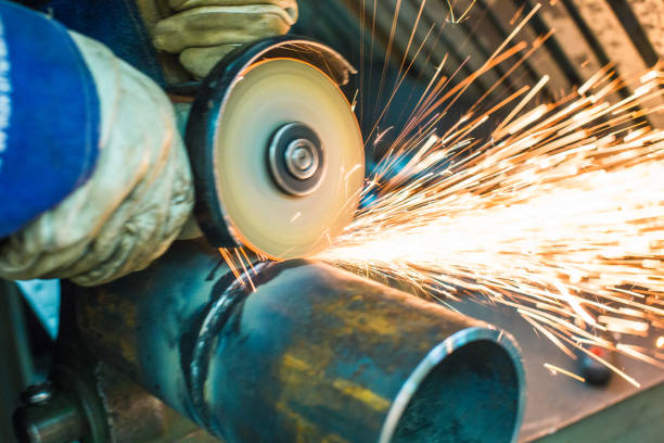 istock mechanic cleans a welded seam 1065760300