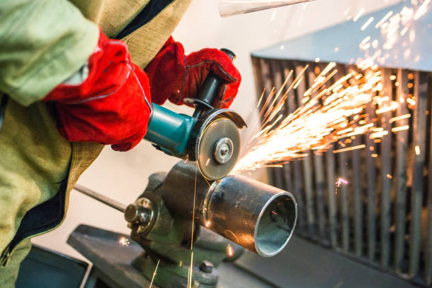 istock mechanic cleans a welded seam on 1065760836