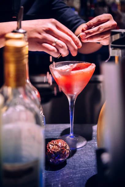 istock Making a glass of vibrant red passion fruit cocktail 1065760952