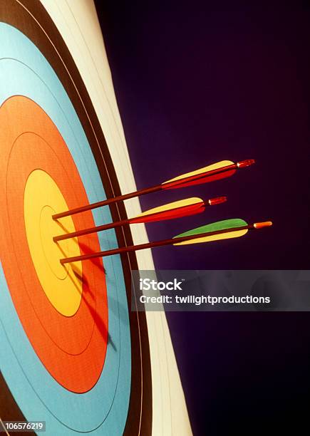 Colorful Bulls Eye Target With Three Arrows In The Center Stock Photo - Download Image Now