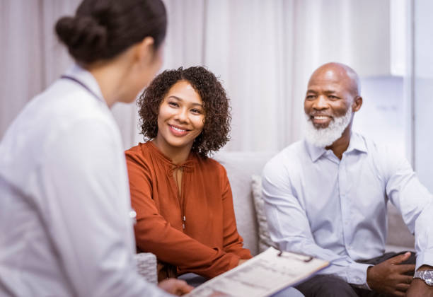 istock Doctor discussing with patient and her father in clinic 1065767832
