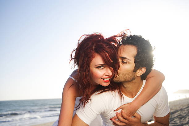 Young Couple At The Beach Stock Photo - Download Image Now - Men, Young Adult, Kissing - iStock Young Couple At The Beach Stock Photo - Download Image Now - Men, Young Adult, Kissing - iStock