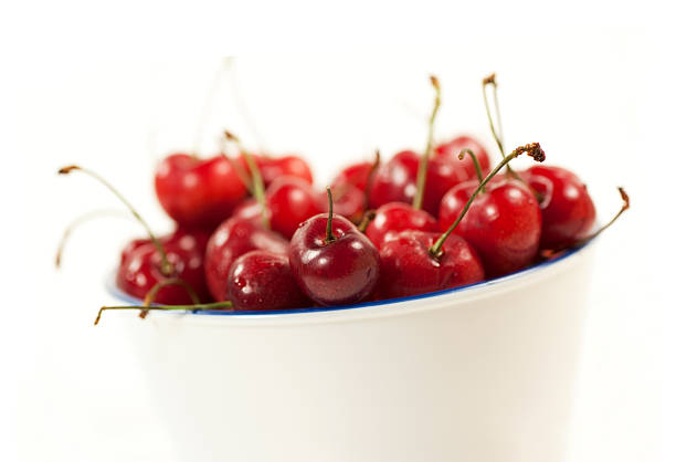 Fresh, healthy, real cherries from organic farming, ecological harvest on wood background.