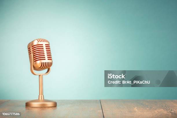 Retro Golden Microphone For Press Conference Or Interview On Table Front Gradient Mint Green Background Vintage Old Style Filtered Photo Stock Photo - Download Image Now