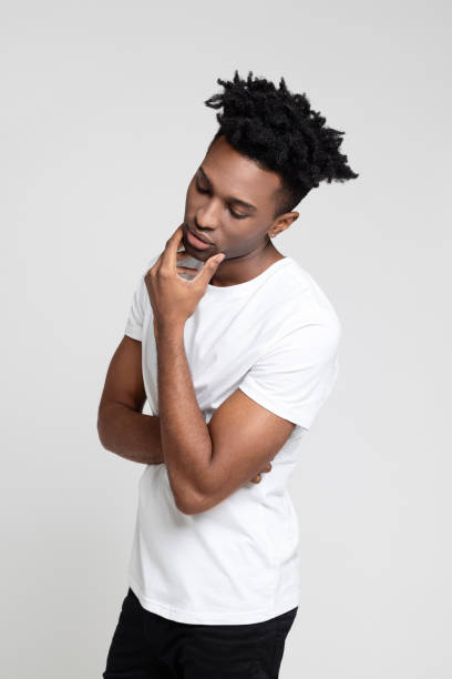 istock Afro american man thinking with his hand on chin 1065780438
