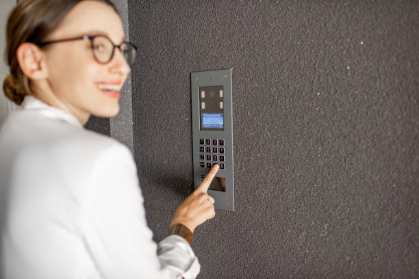 istock Woman entering code on the building entrance 1065781764