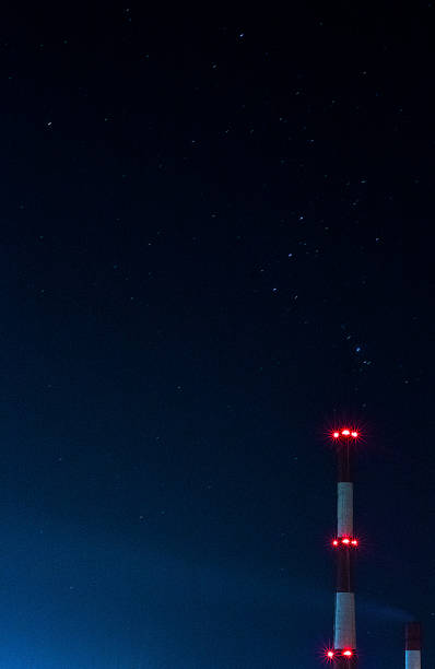 istock Starry sky and power plant tailpipes. 1065782284