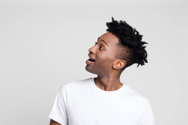 istock Surprised afro american guy looking at copy space 1065783018