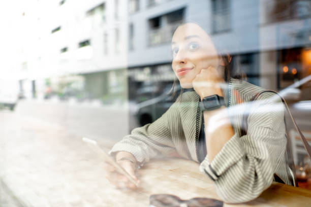istock View through the window on the woman indoors 1065783082