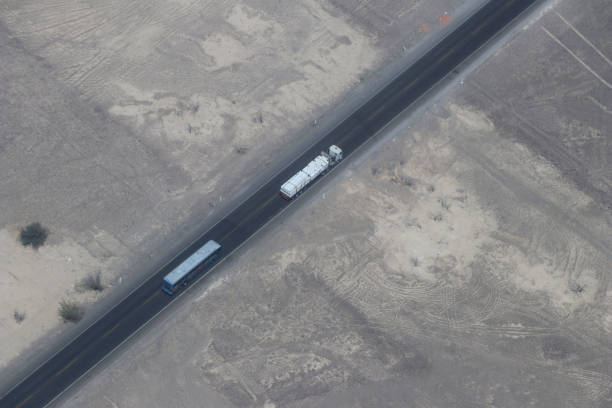 istock lorry and bus in road 1065786814