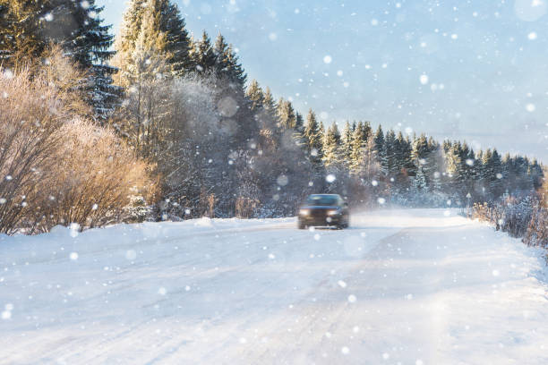 istock The car is driving on a winter road 1065790362