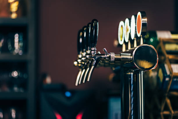 Modern Many beer taps in the beer bar.