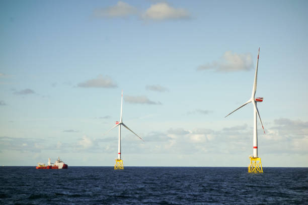 istock Epic view on offshore wind turbines and offshore supply vessel 1065795764