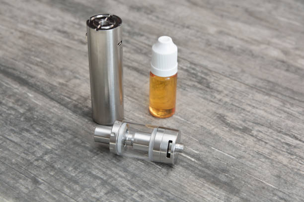 istock E - cigarette for vaping , technical devices.The liquid in the bottle 1065797666