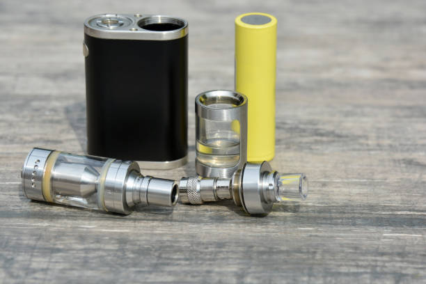 istock E - cigarette for vaping , technical devices.The liquid in the bottle 1065797824