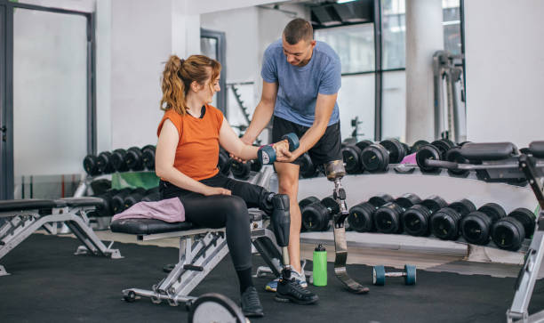 istock Couple exercising in the gym 1065798122