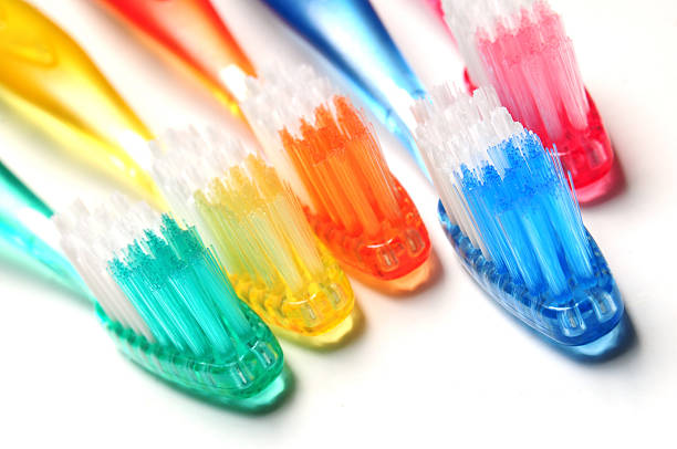 szczoteczki do zębów - toothbrush dental hygiene dental equipment rainbow zdjęcia i obrazy z banku zdjęć