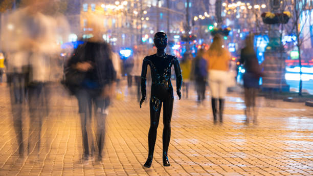 istock The mannequin standing on the crowd street. evening time 1065803894