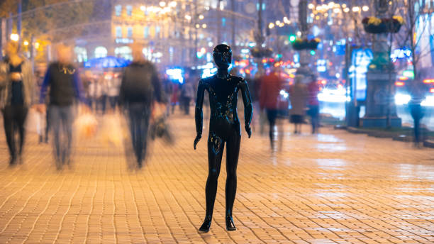 istock The black mannequin standing on the crowd street. evening time 1065803930