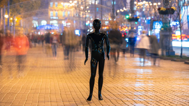 istock The black mannequin standing on the crowd street. evening time 1065803960