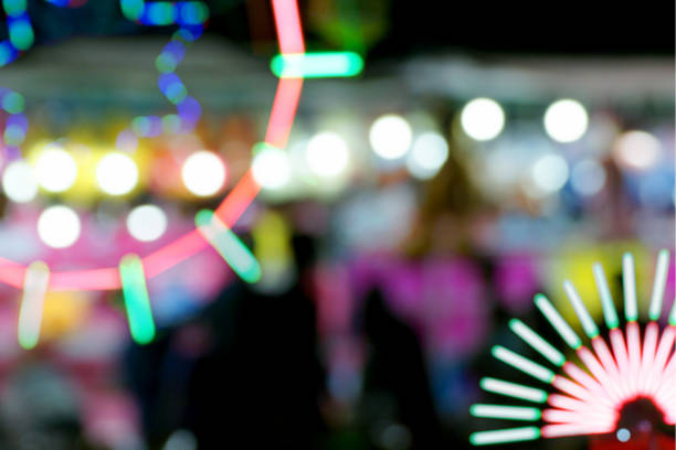 Defocused and blurred image of people at amusement park