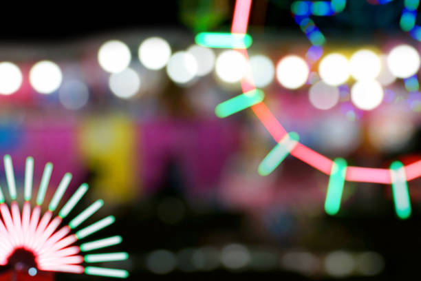 istock Defocused and blurred image of people at amusement park 1065806884