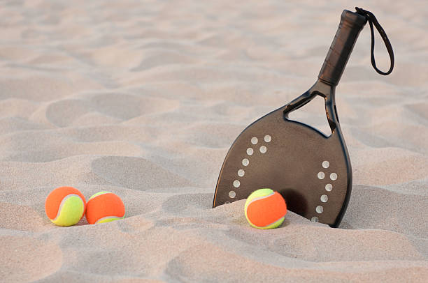 istock Three beach tennis balls and a racket 106580789