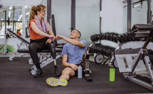istock Man and woman resting after workout in the gym 1065809332