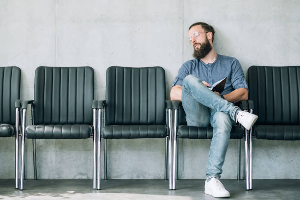 istock applicant tired waiting job interview sleeping man 1065810744