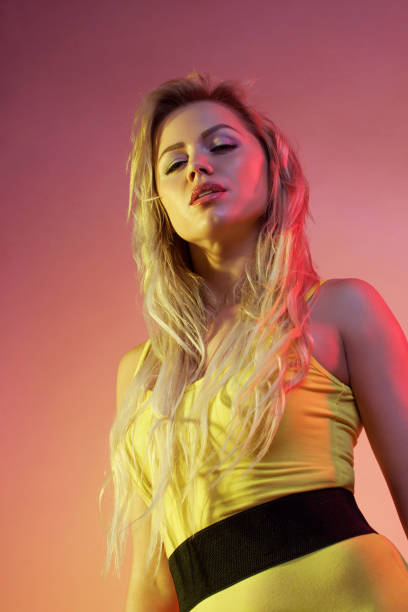 istock Attractive woman in colorful bright lights. 1065812252