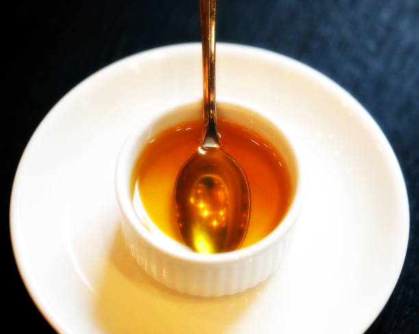 istock Photo of a macro cup with honey 1065813694