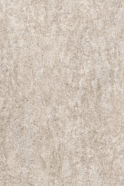 istock Recycle Beige Kraft Paper Bleached Mottled Rough Grunge Texture Sample 1065814068