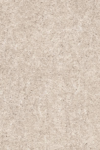 istock Recycle Beige Kraft Paper Bleached Mottled Rough Grunge Texture Sample 1065814094