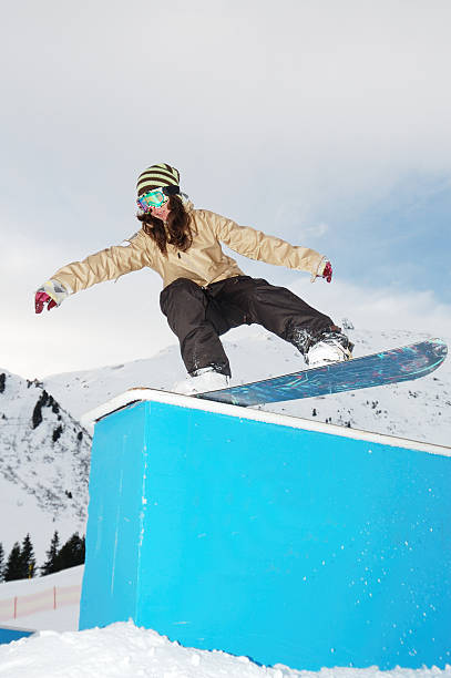 istock young snowboarder woman jibbing 106581892