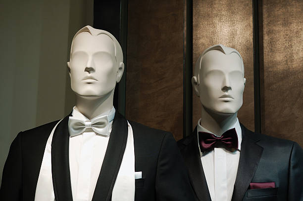 Mannequin man in suit. Expensive suit on a black mannequin. Shop window.