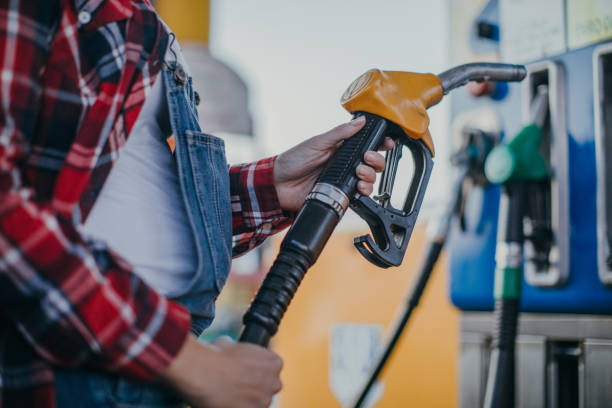 istock Woman refueling gas 1065819488